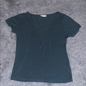low cut, criss cross v-neck shirt